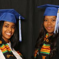 two students smiling for a picture together at GradFest